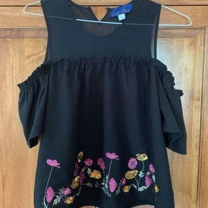 Black top with embroidered flowers